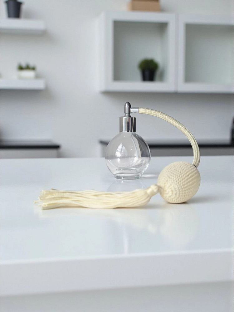 Clear glass 78ml round bottle perfume atomizer with Ivory tassel