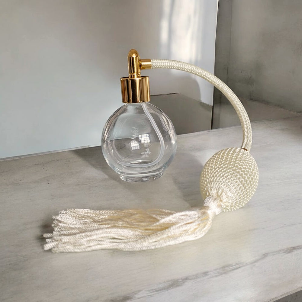 Clear glass 78ml round bottle perfume atomizer with Ivory tassel