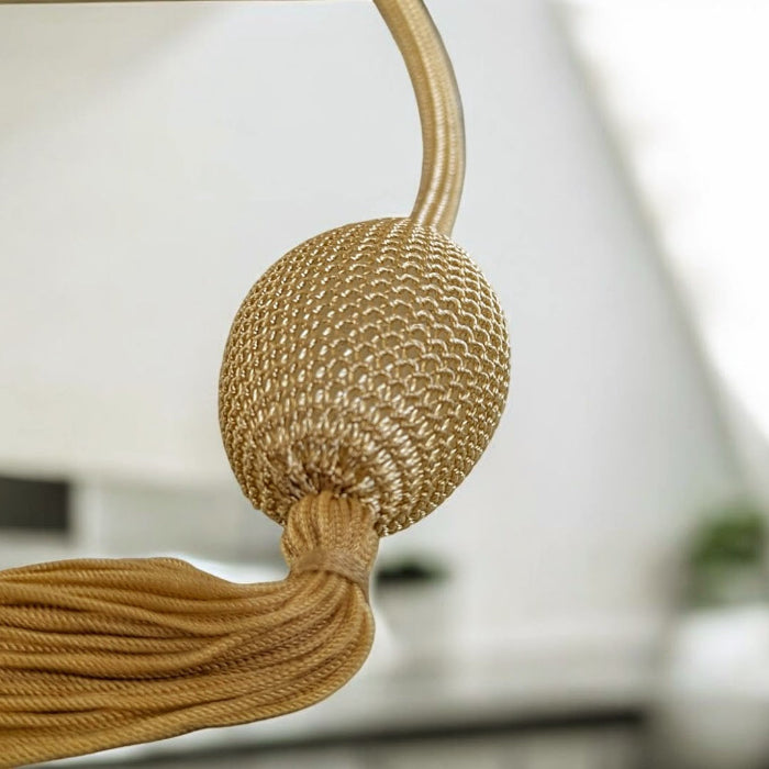 gold tassel atomizer pump head close up