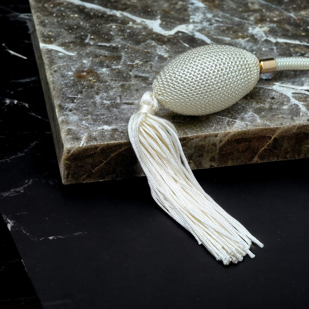 Clear glass 78ml round bottle perfume atomizer with Ivory tassel