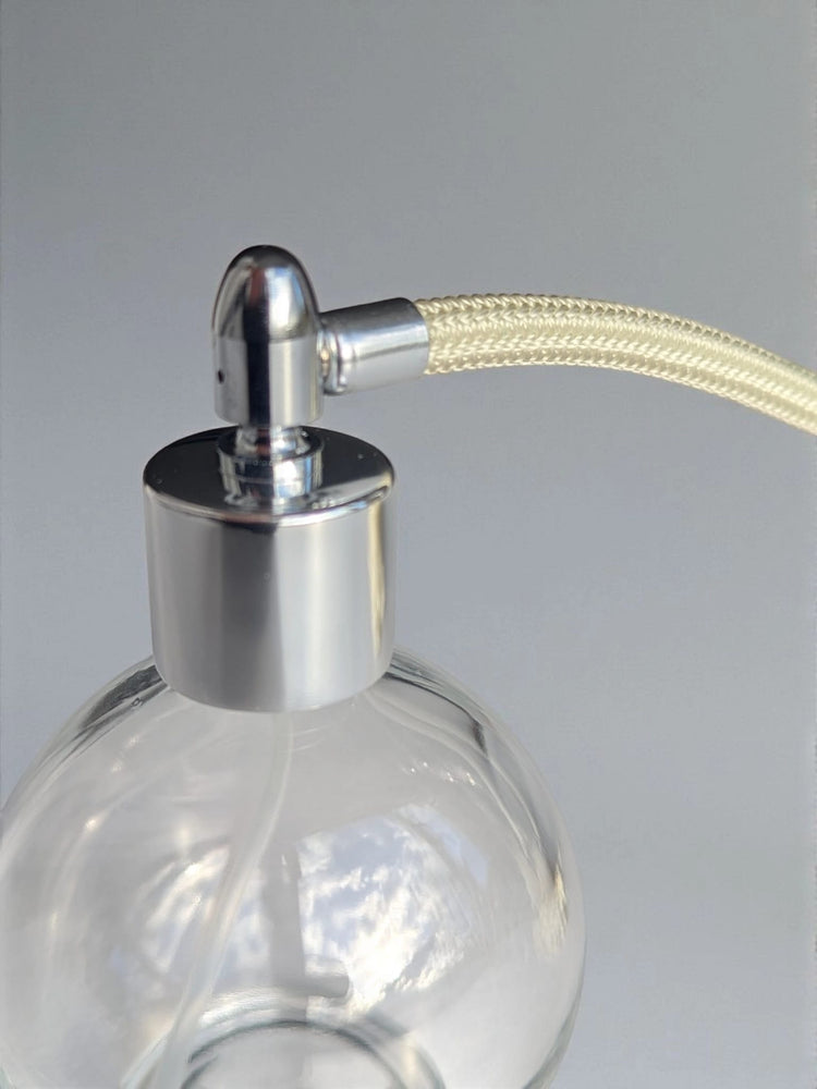 Clear glass 78ml round bottle perfume atomizer with Ivory tassel