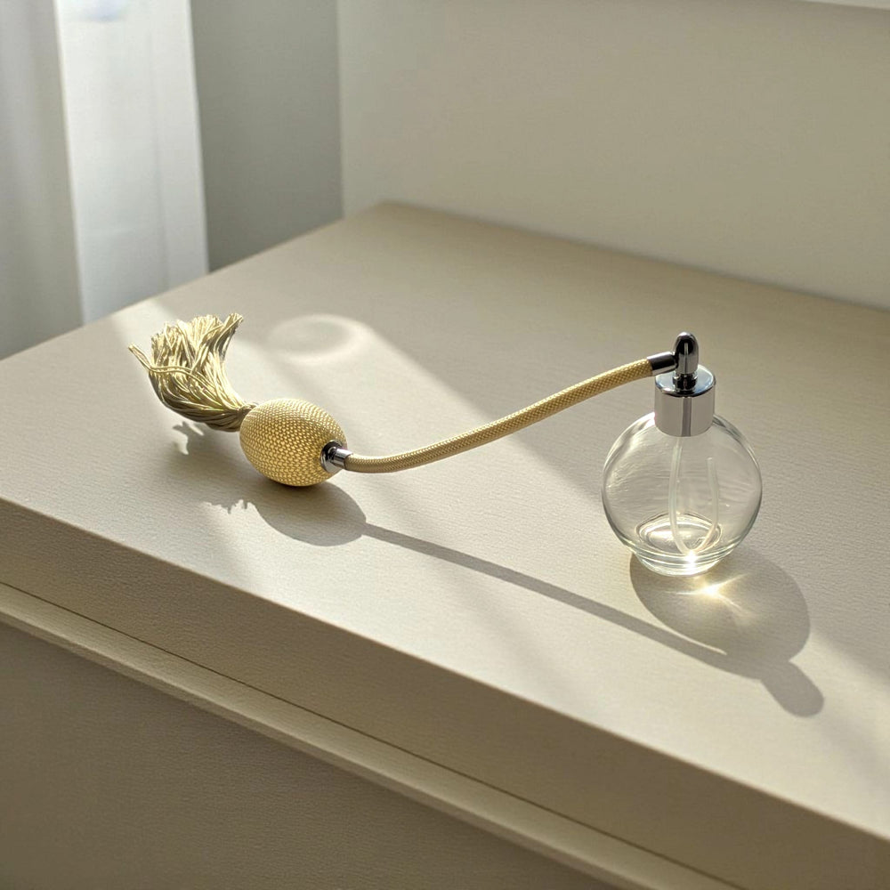 Clear glass 78ml round bottle perfume atomizer with Ivory tassel