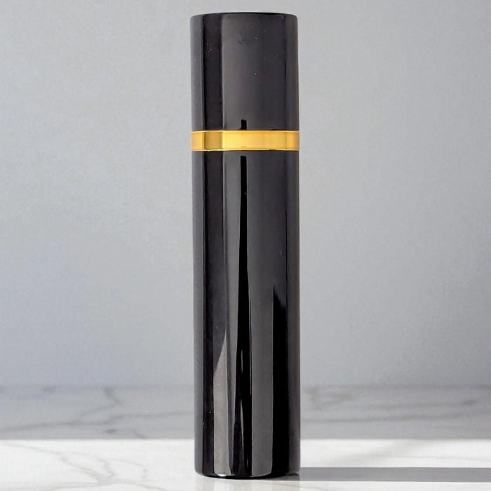 black and gold 10ml perfume atomizer with magnetic lid on white background
