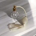 Clear glass 78ml round bottle perfume atomizer with Ivory tassel