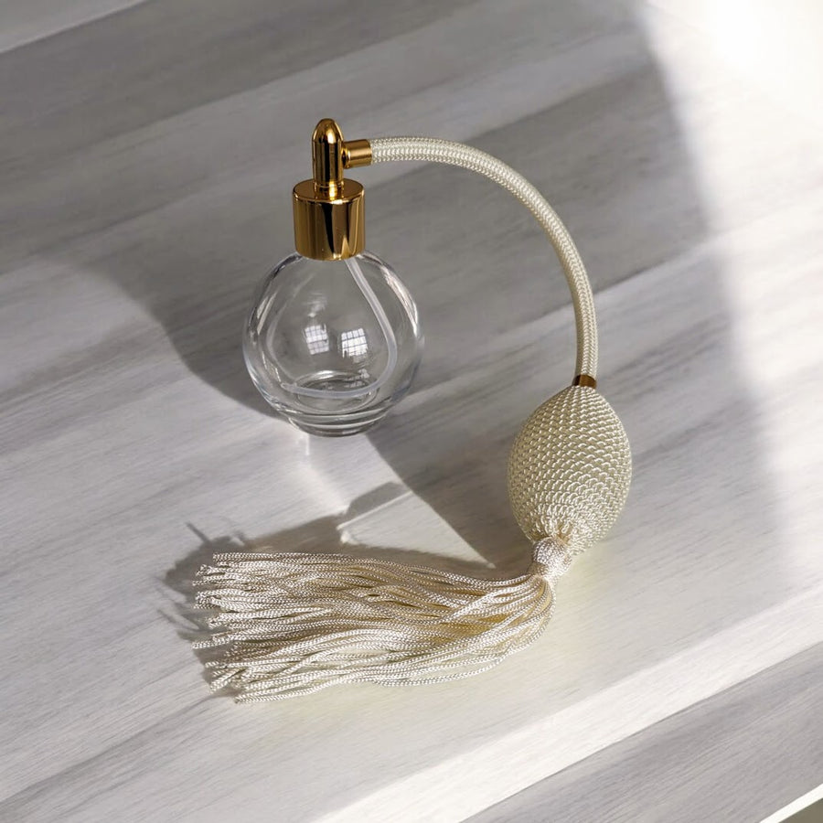 Clear glass 78ml round bottle perfume atomizer with Ivory tassel