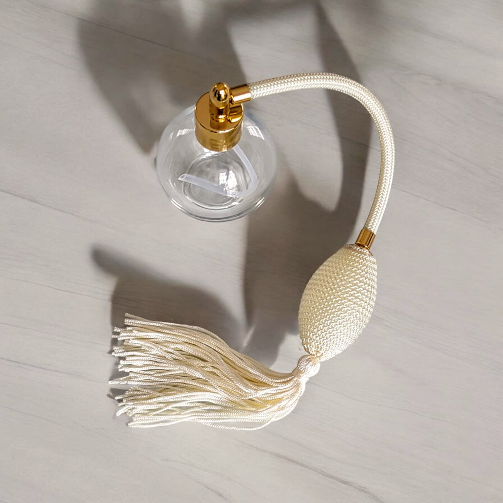 Clear glass 78ml round bottle perfume atomizer with Ivory tassel & Gold fitting