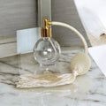 Clear glass 78ml round bottle perfume atomizer with Ivory tassel