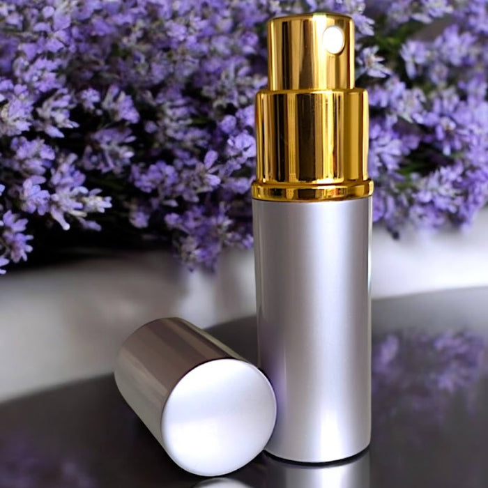 lavender perfume atomizer on with lavender in background