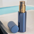 essential atomizer blue halo 5ml easy fill perfume atomizer spray with lid off on surface