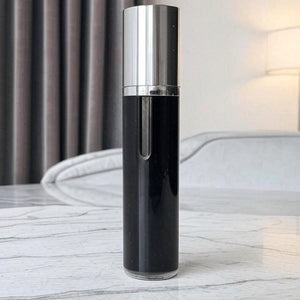 vapora black easy fill perfume atomizer with lid on on marble top