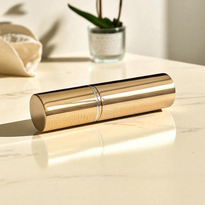 essential atomizer gold halo 5ml easy fill perfume atomizer spray flat on surface with lid on