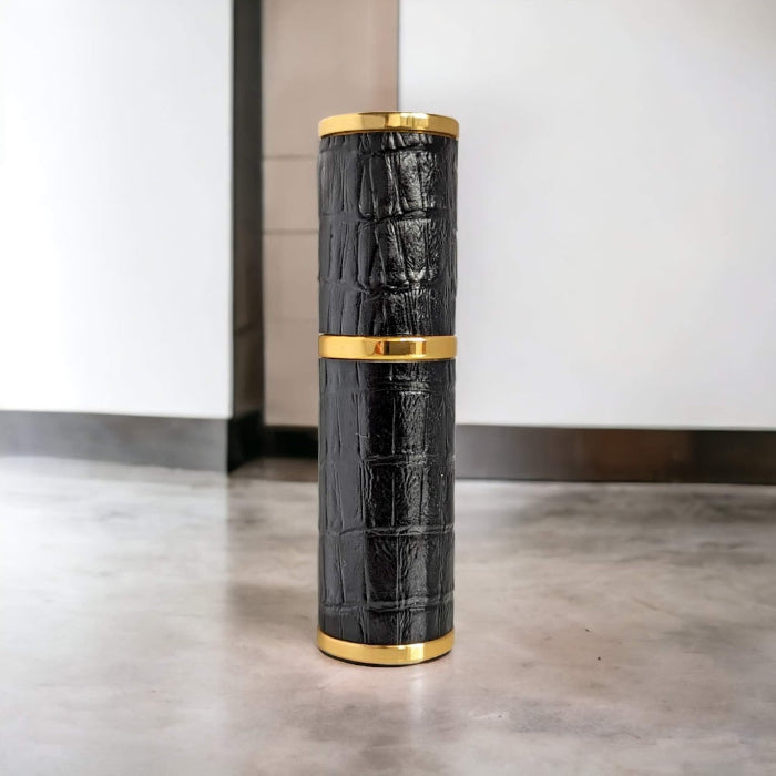 8ml black and gold crocodile style perfume atomizer on surface