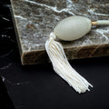 Clear glass 78ml round bottle perfume atomizer with Ivory tassel