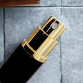 close up of gold travel atomizer spray head